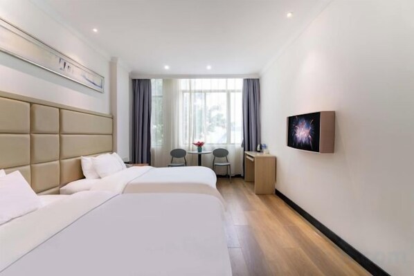A hotel room with two beds, a desk, a chair, a TV, and a window with curtains. - Guangzhou Dipai Hotel (Nansha Jinzhou) (Guangzhou)