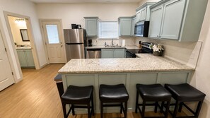 Coffee/tea maker, fridge, microwave, oven