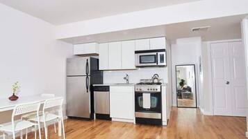 Fridge, coffee/tea maker, cookware/dishes/utensils