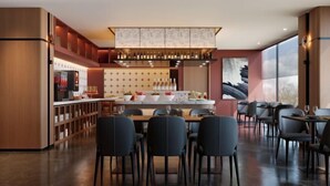 A modern restaurant with a bar area, seating for guests, and a large window providing natural light. - Bolianhui Hotel (Chongqing Southwest Hospital) (Chongqing)