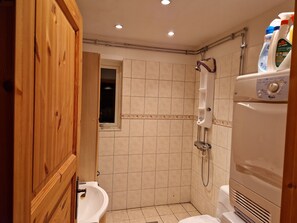 Shower, hair dryer, towels, toilet paper