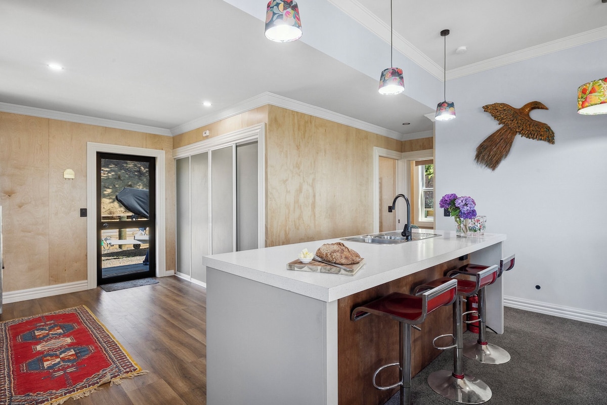 Kitchen island and entry at Moeraki Beach Haven