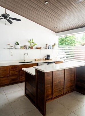 Fridge, stovetop, dishwasher, coffee/tea maker