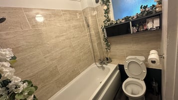 Bidet, towels, soap, toilet paper