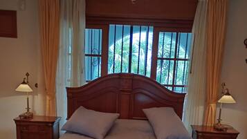 Deluxe Apartment, 3 Bedrooms, Partial Sea View | 5 bedrooms, individually decorated, individually furnished