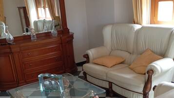 Deluxe Apartment, 3 Bedrooms, Partial Sea View | Living area | 50-inch plasma TV with digital channels