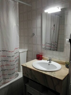 Bidet, towels, soap, toilet paper
