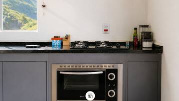 Microwave, cookware/dishes/utensils, dining table