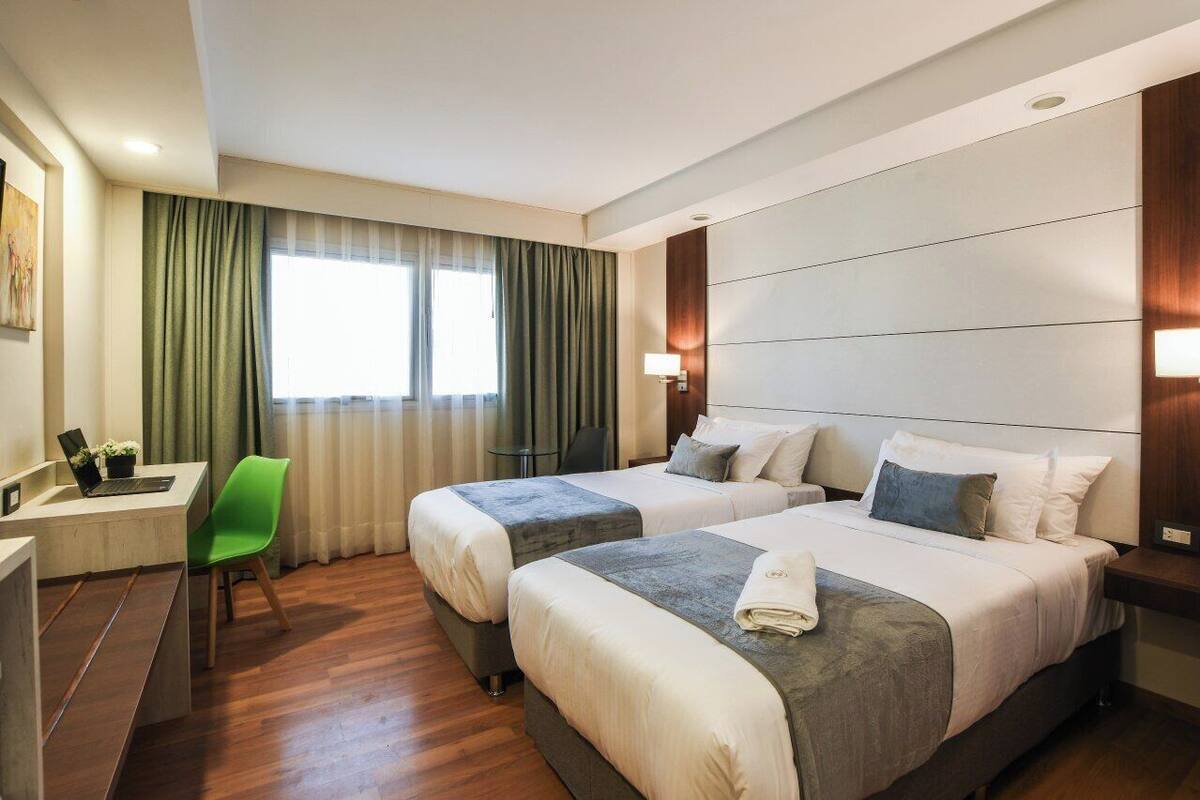 Standard Twin Room | Down comforters, minibar, in-room safe, laptop workspace