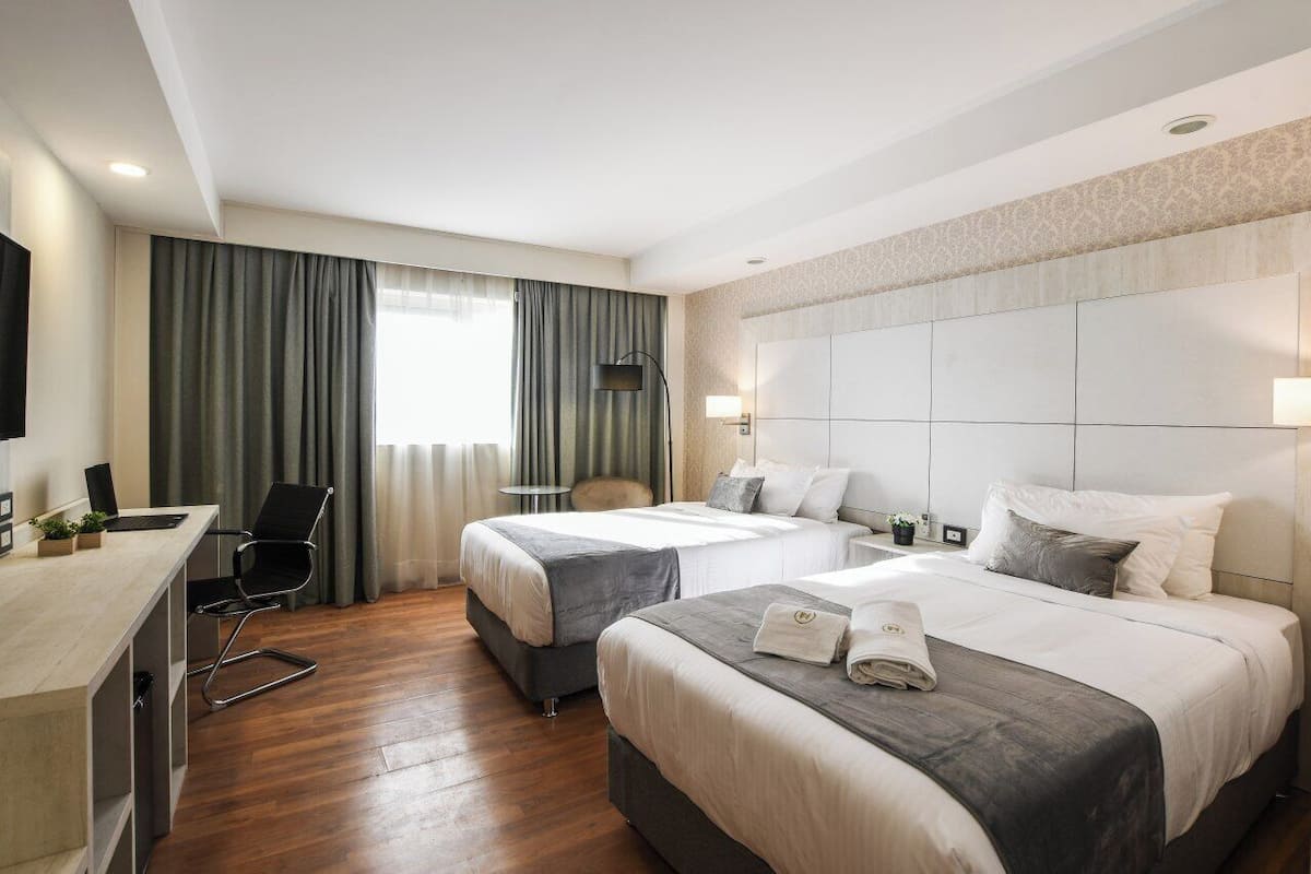 Superior Twin Room, City View | Down comforters, minibar, in-room safe, laptop workspace