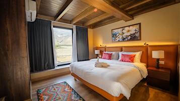 Premium bedding, free minibar items, desk, laptop workspace