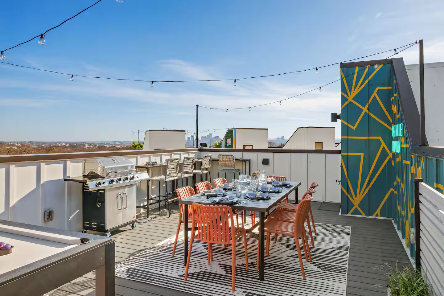 Relax on our rooftop patio, beautifully lit with ambiance lighting and designed for dining with 12 guests. The BBQ grill and skyline views create an unforgettable atmosphere for evening gatherings.