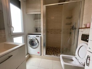 Shower, hair dryer, towels, soap