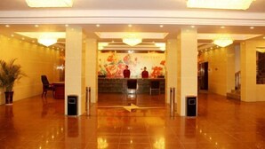 A spacious lobby with a reception desk, large chandeliers, and a polished floor. - Taihe Jinghu Hotel (Taihe)