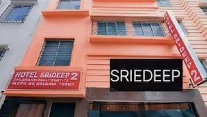 A multi-story building with a sign for 'Hotel Srideep 2' and 'Srideep' prominently displayed. - Hotel Srideep by stayeasy (Kolkata)