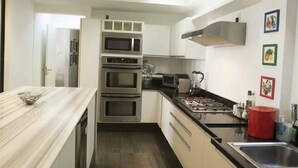 A modern kitchen with built-in appliances, a stainless steel sink, and a marble countertop. - ROCK IN RIO 2026 PROMO Sep 5th to 14th
Best Location Best Living in Rio. (Rio de Janeiro)