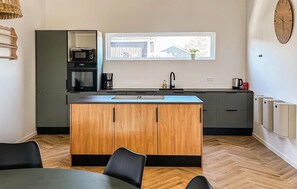 Fridge, dishwasher, coffee/tea maker, cookware/dishes/utensils