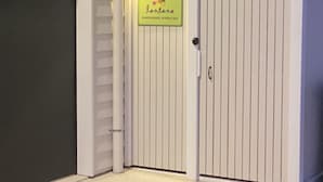 A gated entrance with a sign that reads "lanta" and "GUESTHOUSE ESTON BAY". - Spacious Byron Central Studio Apartment w/ Private Balcony (Byron Bay)