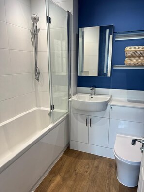 Shower, hair dryer, towels, soap