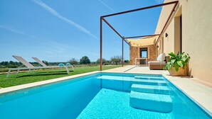 A swimming pool with steps leading into it, a covered seating area, and a view of the surrounding landscape. - Rural House 'Son Rossinyol Nou - Ses Figueretes' with Mountain Views, Private Pool and Wi-Fi (Illes Balears)