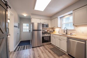 Fridge, microwave, oven, stovetop - Cozy Retreat with Screened Porch, Fire Pit & Lake Michigan Overlook (South Haven)