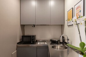 Fridge, microwave, stovetop, coffee/tea maker