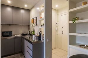 Fridge, microwave, stovetop, coffee/tea maker