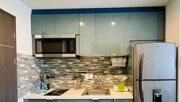 Fridge, microwave, stovetop, coffee/tea maker