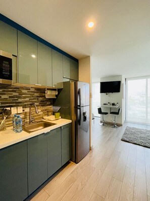 Fridge, microwave, stovetop, coffee/tea maker