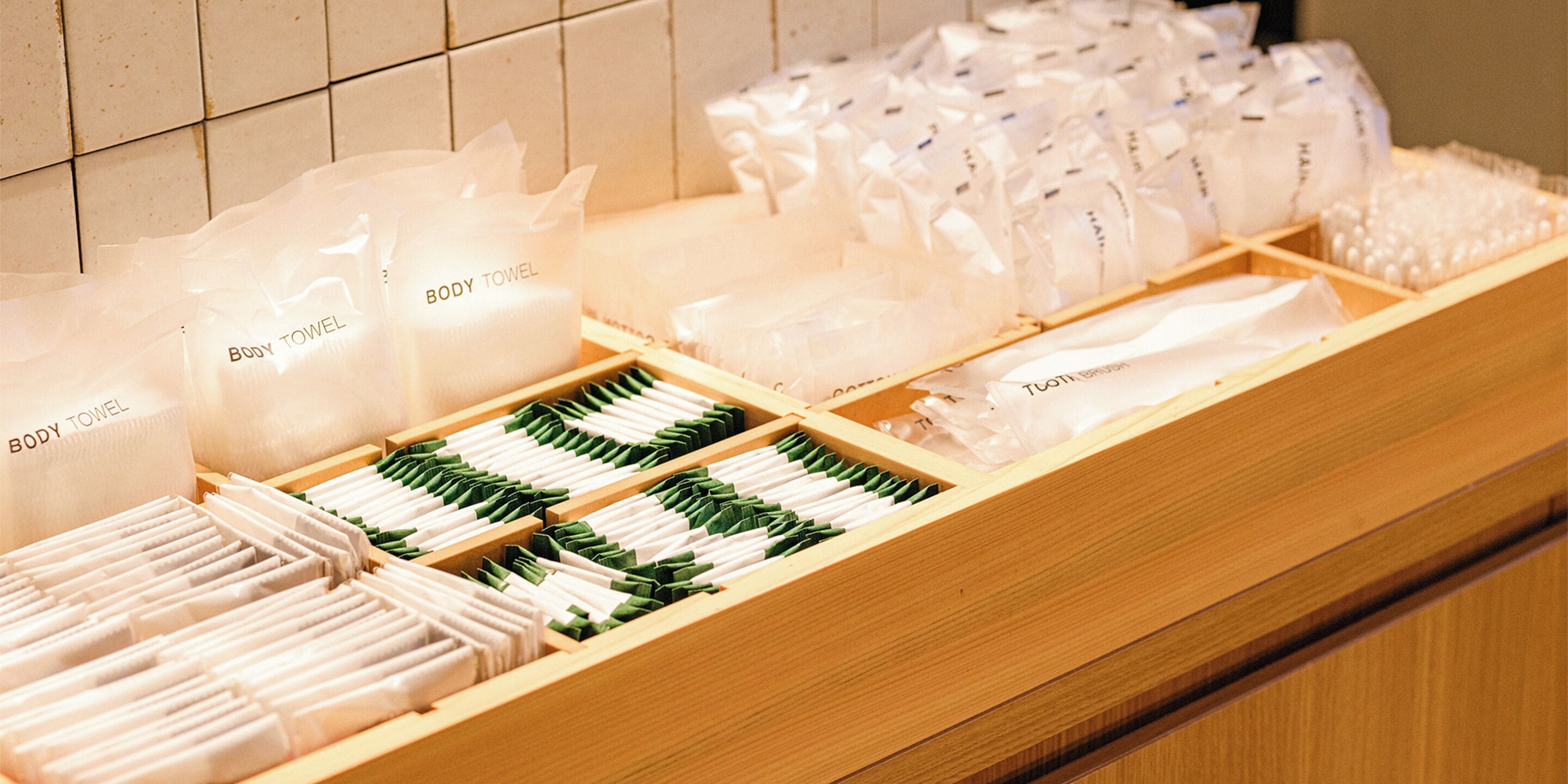 A display of body towels and toiletries in a hotel setting.
