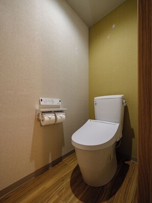 Economy Twin Room | Bathroom | Hair dryer, slippers, towels, soap