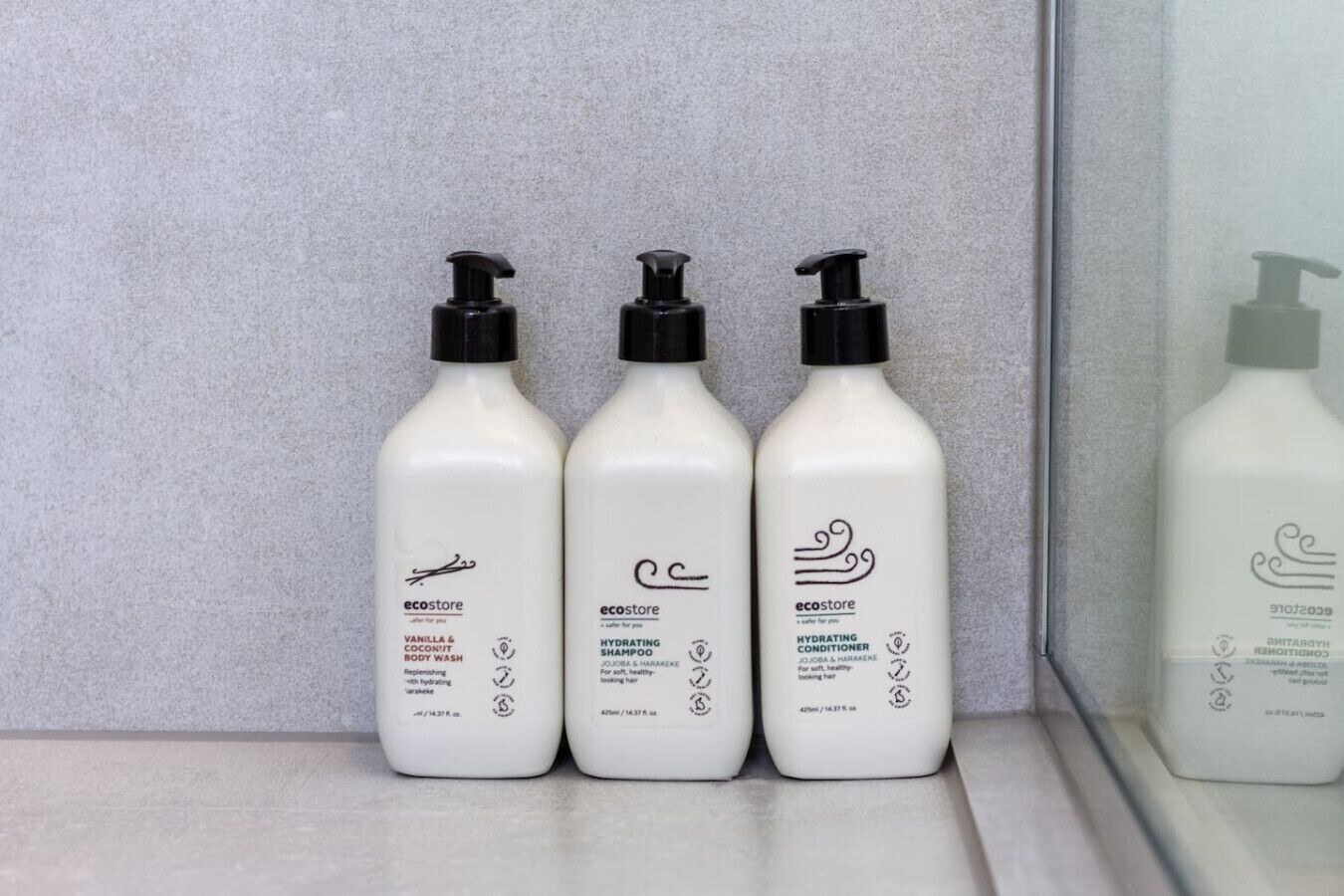 Three bottles of Ecostore products on a shelf.