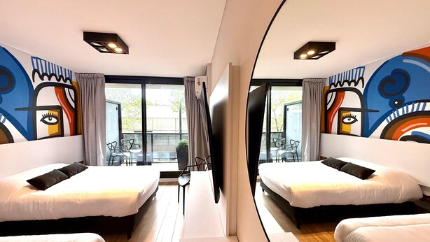 A hotel room with two beds, a large window, and a view of the outside. - CloudBA Godoy Cruz Soho Apartments (Buenos Aires)