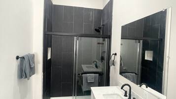 Shower, towels, soap, toilet paper