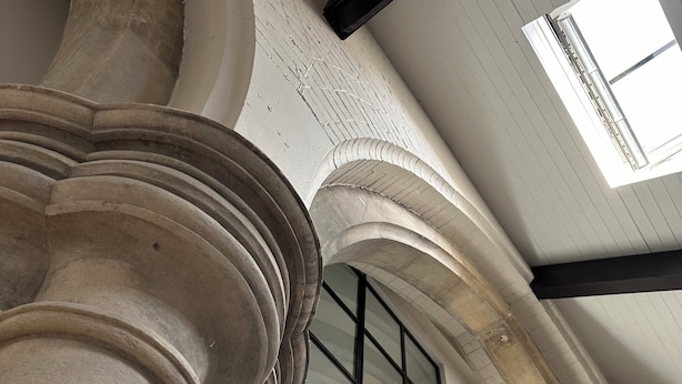 A high ceiling with large windows and a view of a person inside. - The Nave a unique duplex apartment in a historic converted church near to beach. (Waterloo)