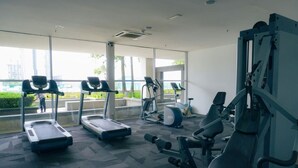 A modern gym with treadmills, elliptical machines, and weightlifting equipment. - iSovo-iCity#3slep#Studio#netflix (Shah Alam)