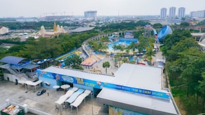An amusement park with a water park area, including slides and a pool. - iSovo-iCity#3slep#Studio#netflix (Shah Alam)