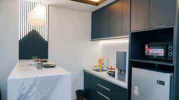 Microwave, stovetop, toaster, dining tables