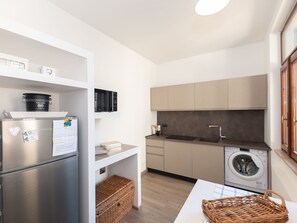 Fridge, microwave, cookware/dishes/utensils