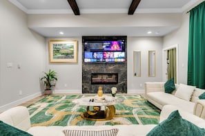Smart TV, fireplace, books