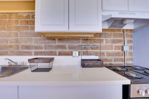 Fridge, stovetop, coffee/tea maker, cookware/dishes/utensils