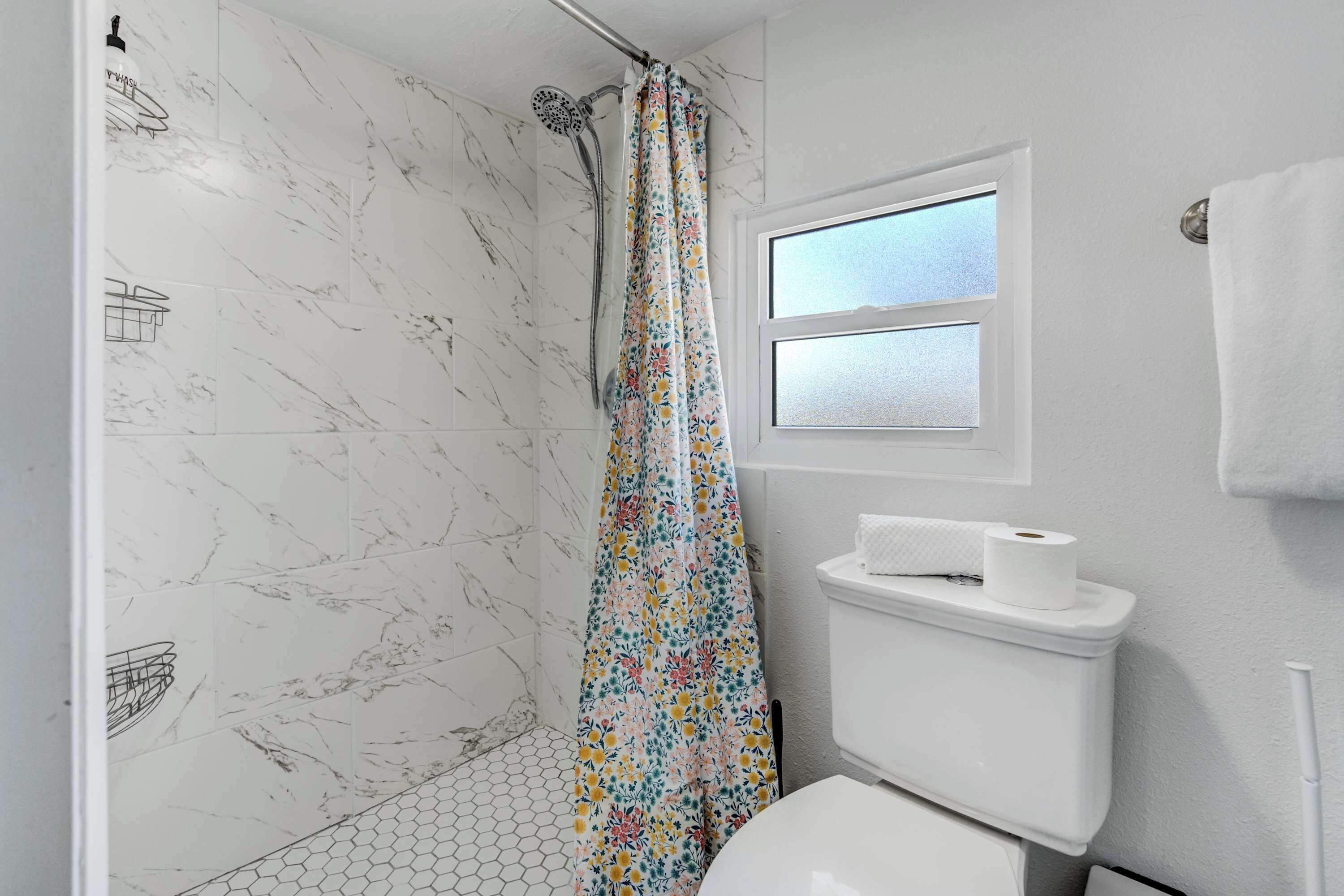 Shower, hair dryer, towels, shampoo