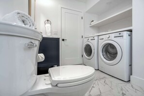 Shower, hair dryer, towels