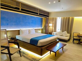 Deluxe Suite, City View | In-room safe, desk, laptop workspace, blackout drapes