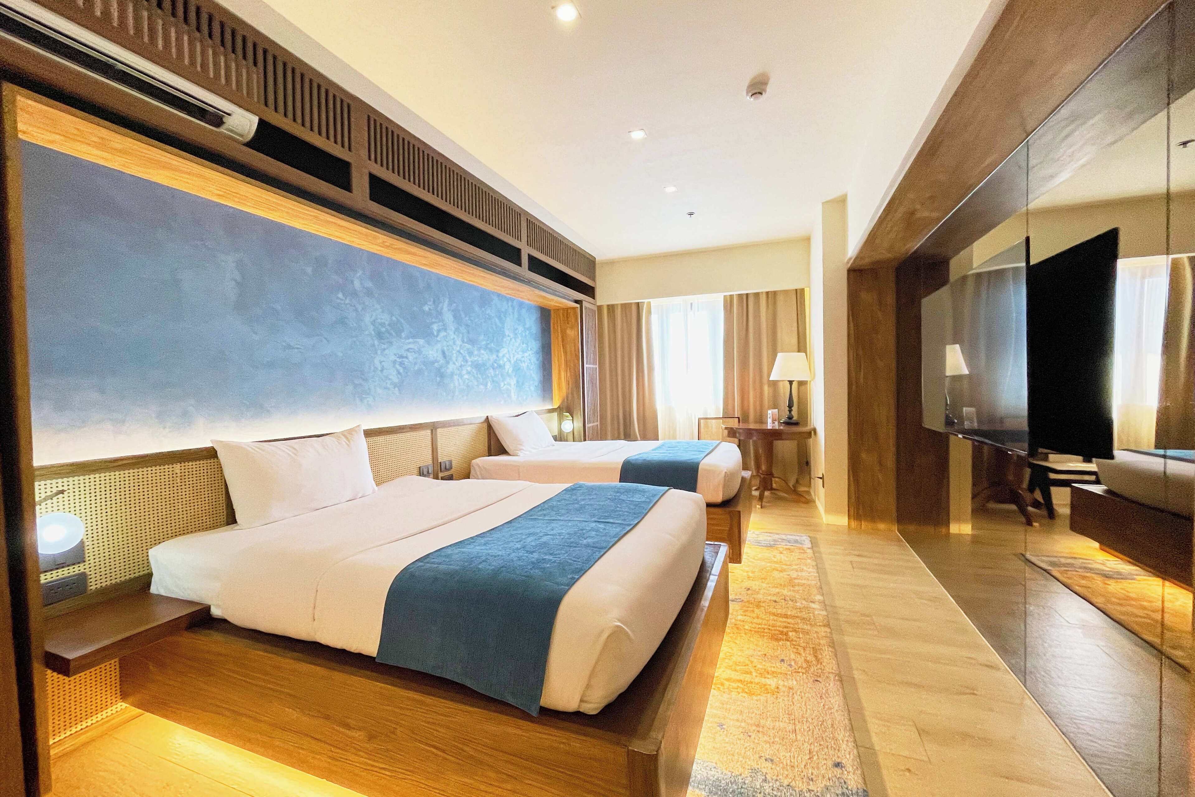 Chambre Deluxe avec lits jumeaux | Bureau, rideaux occultants, fer et planche à repasser, Wi-Fi gratuit