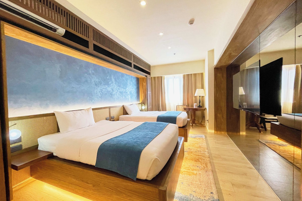 Chambre Deluxe avec lits jumeaux | Bureau, rideaux occultants, fer et planche à repasser, Wi-Fi gratuit