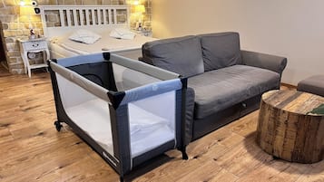 1 bedroom, desk, iron/ironing board, travel crib