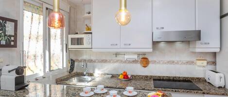 Fridge, microwave, oven, cookware/dishes/utensils