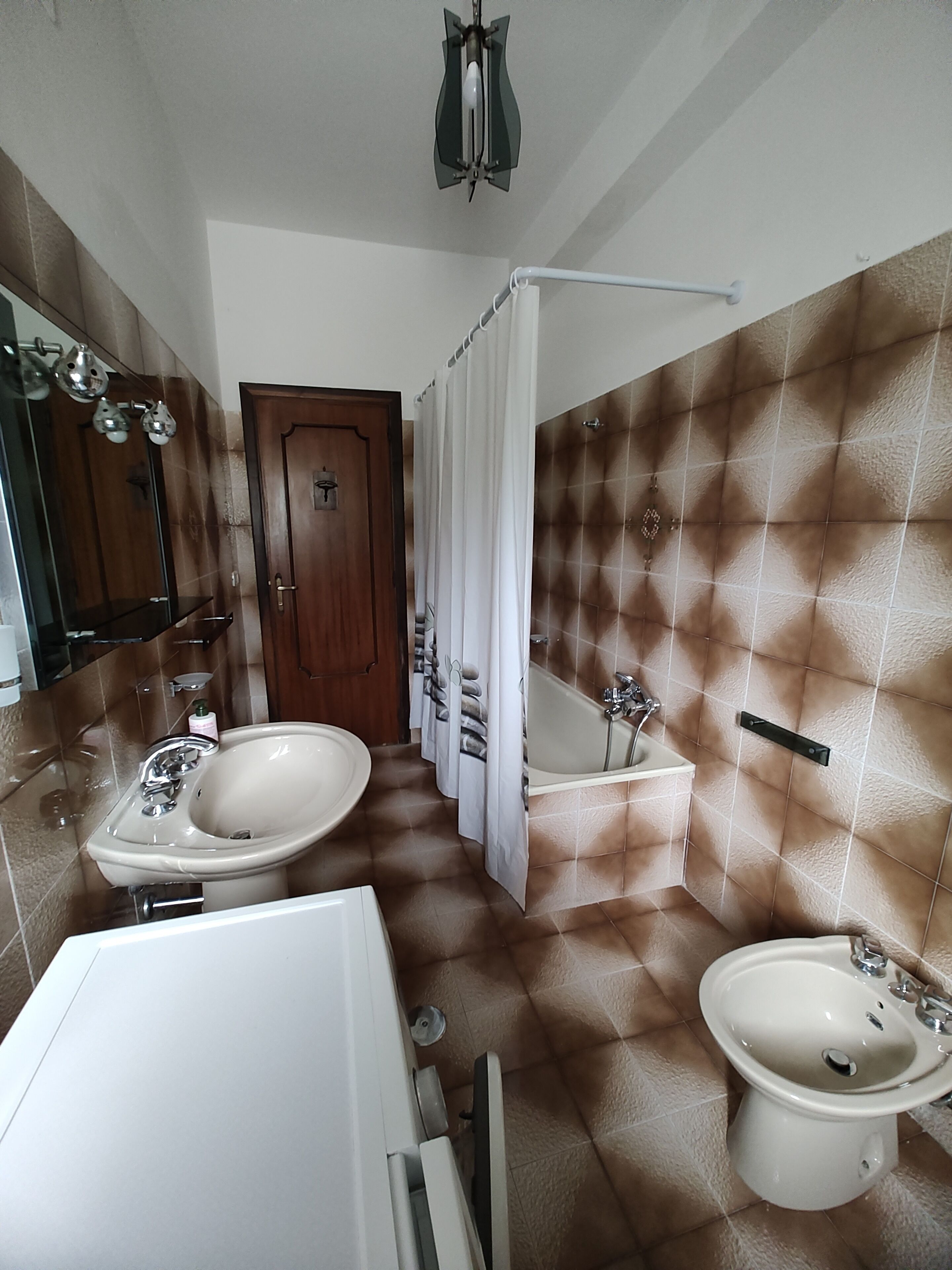 Bidet, towels, toilet paper