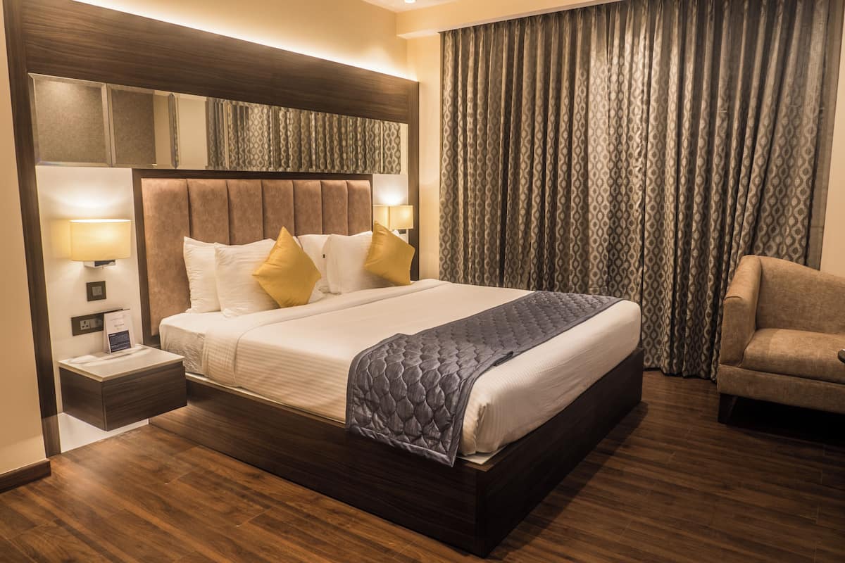 Luxury Room, Pool View | In-room safe, blackout drapes, iron/ironing board, free WiFi